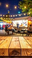 Nighttime food market with wooden foreground, blurred background