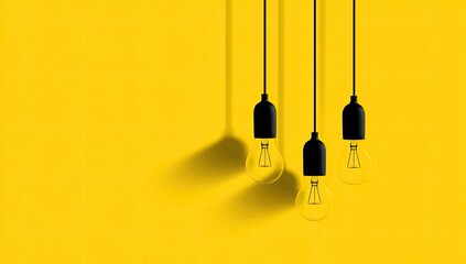 Three glowing light bulbs hang from cords, casting shadows on a bright yellow background