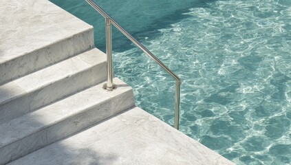 Marble stairs descend into clear, rippling blue water with a metal handrail