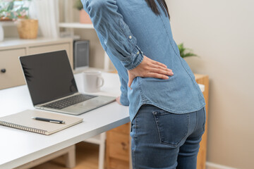Body muscles hurt stiff, suffering asian young woman, girl back pain, body ache while stand up from...