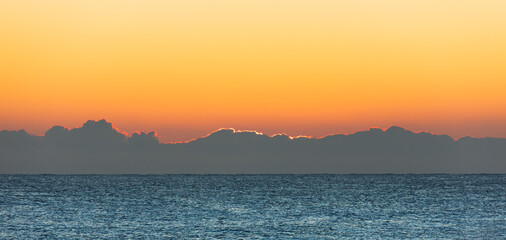 Sunlight Obscured by Low Clouds at Sunrise
