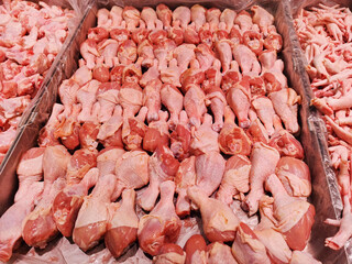 Fresh chicken drumsticks, chicken legs, chicken pieces, background image, fresh food on the counter, chicken meat market.