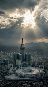 Golden hour light breaking through dramatic clouds showing Bait Ullah, Makkah. Eid or Muslim Islam related festival greeting video, copy space.
