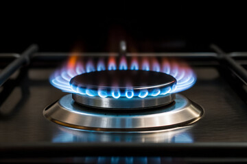 Close-up of a gas stovetop burner with vibrant flames