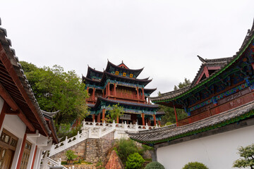 Naklejka premium Beautiful architecture of Dongba Culture Research Institute at Black Dragon Pool Park in Lijiang Old Town, China