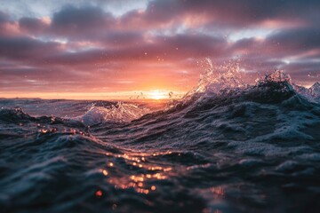 Dramatic sunset over churning ocean waves, light reflecting and illuminating the water