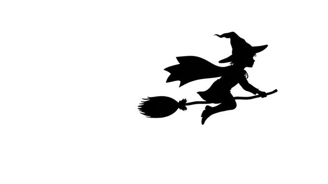 Silhouette of a child witch flying on a broomstick