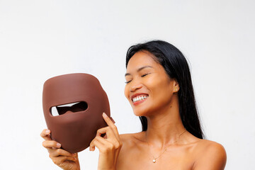 Portrait series of woman interacting with LED facial mask for skincare, beauty tech, and light therapy. Concept of modern wellness and self-care innovation.