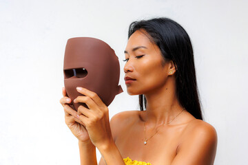 Portrait series of woman interacting with LED facial mask for skincare, beauty tech, and light therapy. Concept of modern wellness and self-care innovation.