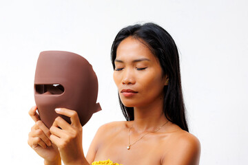 Portrait series of woman interacting with LED facial mask for skincare, beauty tech, and light therapy. Concept of modern wellness and self-care innovation.