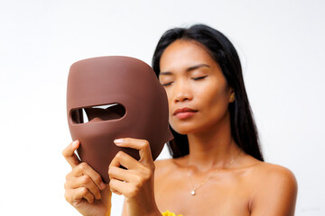 Portrait series of woman interacting with LED facial mask for skincare, beauty tech, and light therapy. Concept of modern wellness and self-care innovation.