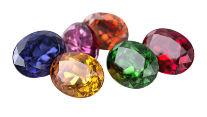 A cluster of seven faceted gemstones in various vibrant colors, set against a black backdrop