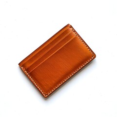 Brown leather card holder with white stitching on plain background