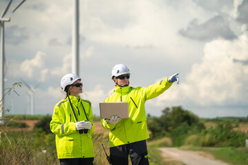 Wind energy inspection team wind farm professional engagement outdoor setting collaborative viewpoint renewable energy insights