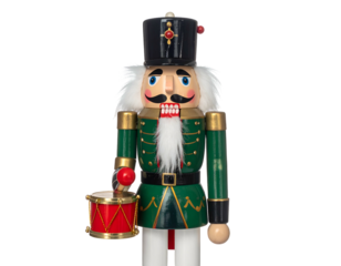 A wooden toy soldier nutcracker in a green and gold uniform, holding a drum