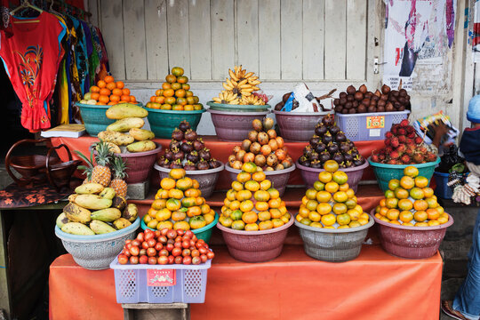 Colorful fresh tropical fruit display at Bali market in Denpasar Indonesia