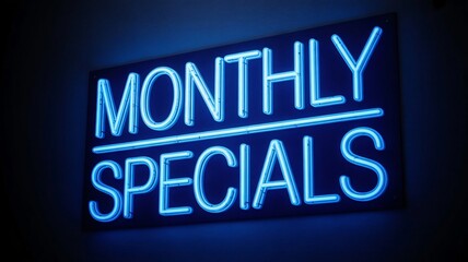 Bright blue neon sign illuminates the dark background proclaiming monthly specials a perfect advertisement for retail sales and limited time offers