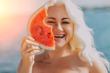 Woman Watermelon Beach Summer: Joyful portrait, woman playfully holds watermelon slice near ocean, sunny day.