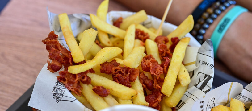  Home made   Fresh fried French fries with baco non wooden background