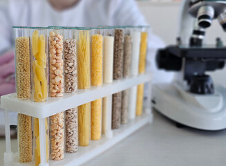 Collection of various grains and pasta samples under microscope in laboratory