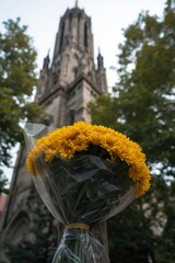 Yellow flowers in front of historic church
