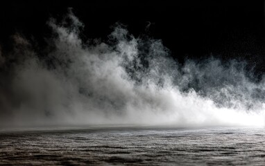 A stark, contrasting view of rising white mist against a solid dark background, like a fog-filled scene