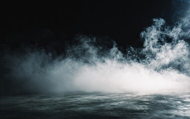 Atmospheric shot of thick, white fog billowing across a dark, textured surface. Dramatic lighting