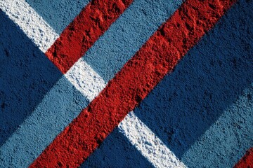 Bold red, white, and blue stripes diagonally across a textured surface