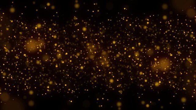 gold particles and glitters on black background 4k footage, particles for awards and titles for clean and royal events footage