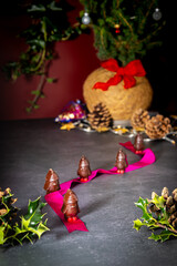 Chocolate penguins on a table with Christmas decorations
