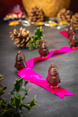 Chocolate penguins on a table with Christmas decorations