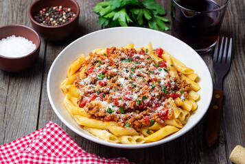 Pasta with bolognese sauce and cheese. Italian cuisine. Traditional recipe. © Vladislav Chusov