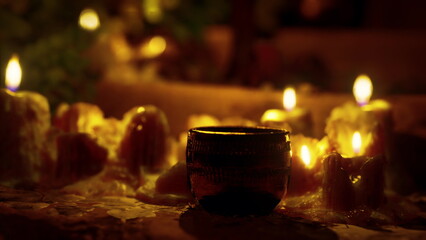 Candles softly light up a serene environment, casting gentle shadows and creating a peaceful atmosphere. The rich scent of wax and the flicker of flames invite relaxation and calm.