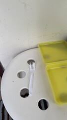 White Plastic Fork on Simple Stool