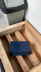 Blue Wallet on Rustic Wooden Pallet