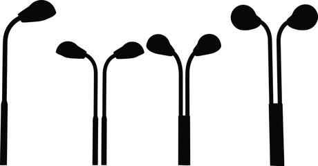 Black silhouettes of golf clubs on white background