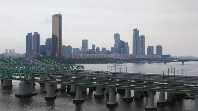 Seoul's Han River Railway Bridge aerial shot, trains and trains pass by.