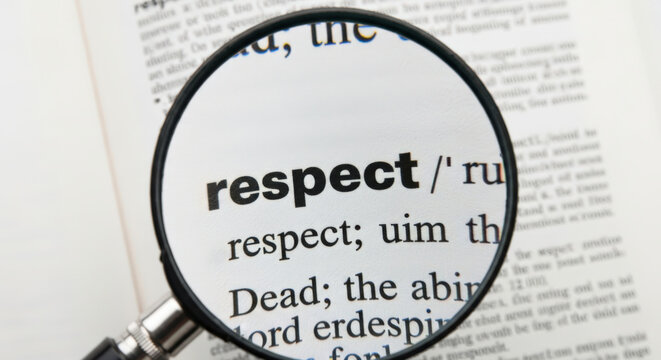 Exploring the Essence of Respect A Close Up View of the Dictionary Definition with a Magnifying Glass Revealing the Importance of Understanding and Valuing Others