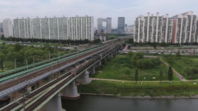 Seoul's Han River Railway Bridge aerial shot, trains and trains pass by.