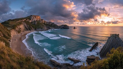 Dramatic coastal cliffs meet the ocean at sunset with fiery skies