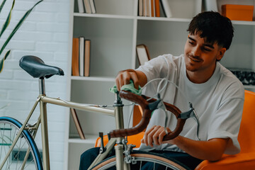young man cleaning or preparing vintage bicycle