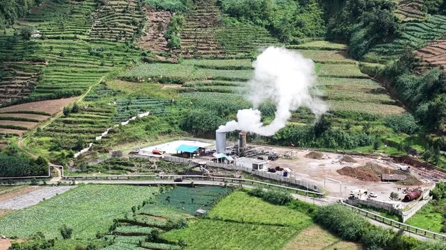 Aerial shot of the Wellpad geothermal power plant located in Dieng, Central Java, Indonesia. The starting point for the development and production of underground energy resources.