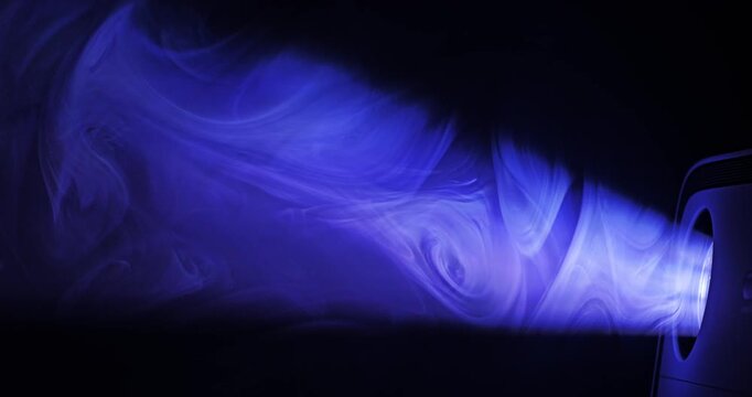 Spotlight Beam Through Haze. Projector light ray piercing atmospheric smoke, building dramatic volumetric glow against dark background.