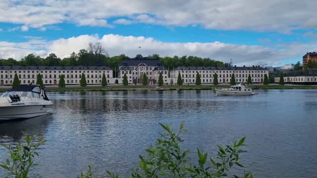 Shot over Karlbergskanalen with Karlberg Palace (Karlbergs slott) and Stockholm&rsquo;s Vasastaden district in the background on a partly cloudy day, Sweden