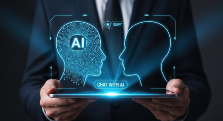 AI Chat Concept with Human and Artificial Intelligence Head Silhouettes on a Tablet Screen Held by a Person in a Suit for Technology and Communication