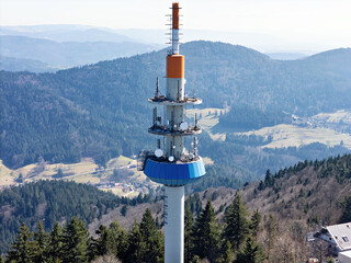 Communication tower with radio antennas on the summit of Blauen mountain near Schliengen in the Black Forest