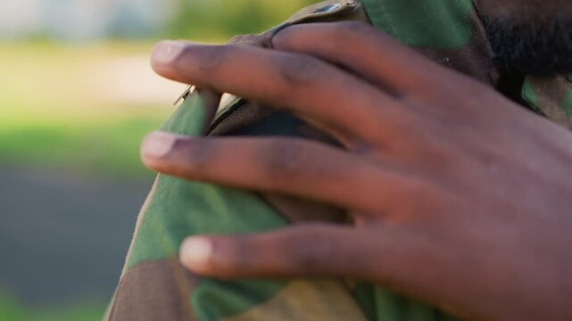 Military Pride Check, Focused Image Of Military Leader Aligning Insignia With Determination, Detailed Shot Of Commanding Officer Adjusting Shoulder Patch During Moment Of Readiness And Honor