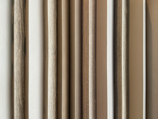 Fototapeta premium Natural brown oak wood fluted panel or fluted strips, rustic wood. Seamless background texture.