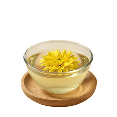 Yellow chrysanthemum flower floating in a glass teacup