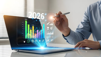 Businessman analyzing futuristic data on laptop with digital graphs